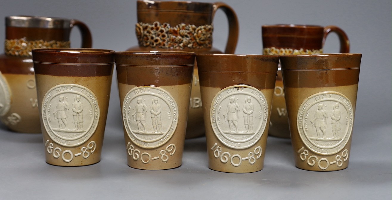 National Rifle Association, salt glazed stoneware, three jugs and four tumblers, 1860-1889, tallest 17cm